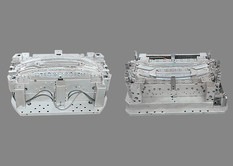 Two long tail-lamp mould halves shown side by side